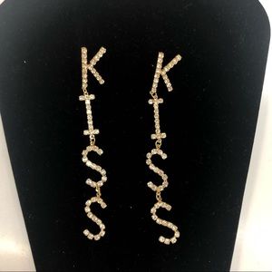 Kiss drop earrings in gold . With post back